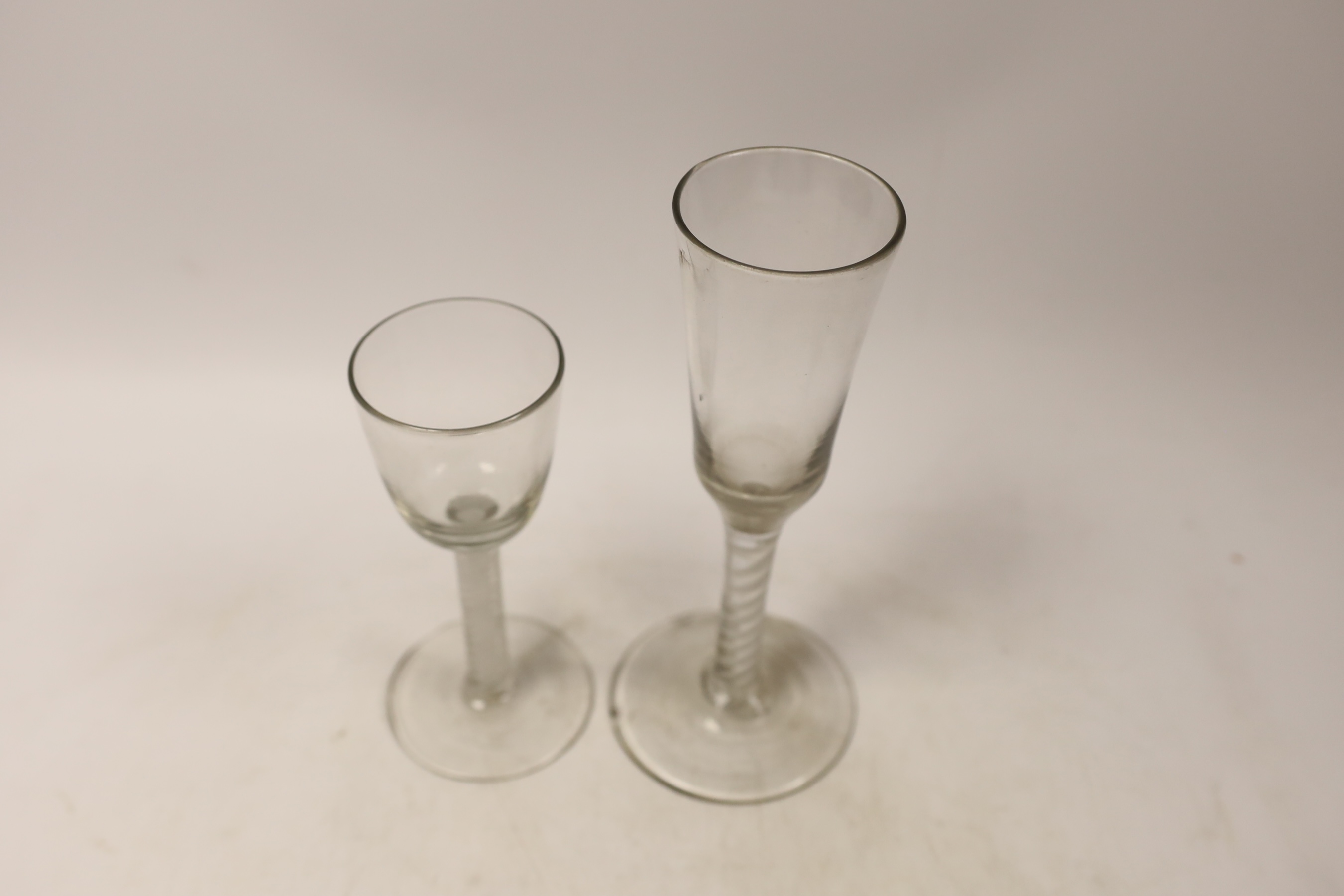 A George III DSOT stem wine glass, and single opaque twist stem ale glass, tallest 20cm